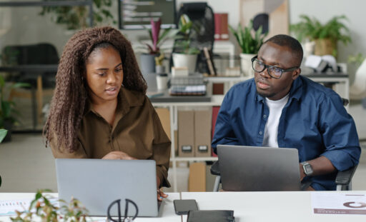 A Ghanaian business owner and professional consultant reviewing company performance, sales data, operational challenges, and a business turnaround strategy with LuminCore Consult. Business consultant in Ghana; business turnaround in Ghana; business consultancy in Ghana; struggling company in Ghana; best consulting firm in Ghana.