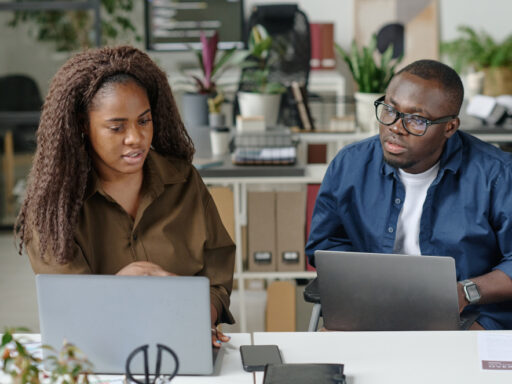 A Ghanaian business owner and professional consultant reviewing company performance, sales data, operational challenges, and a business turnaround strategy with LuminCore Consult. Business consultant in Ghana; business turnaround in Ghana; business consultancy in Ghana; struggling company in Ghana; best consulting firm in Ghana.
