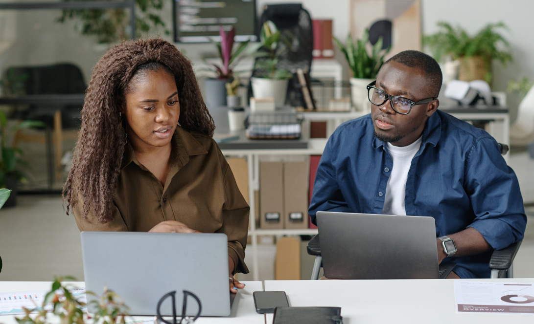 A Ghanaian business owner and professional consultant reviewing company performance, sales data, operational challenges, and a business turnaround strategy with LuminCore Consult. Business consultant in Ghana; business turnaround in Ghana; business consultancy in Ghana; struggling company in Ghana; best consulting firm in Ghana.